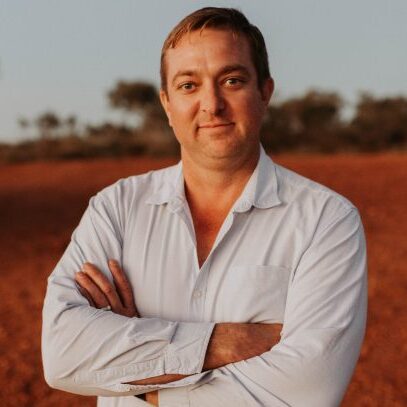 Mick Scotney standing in the outback